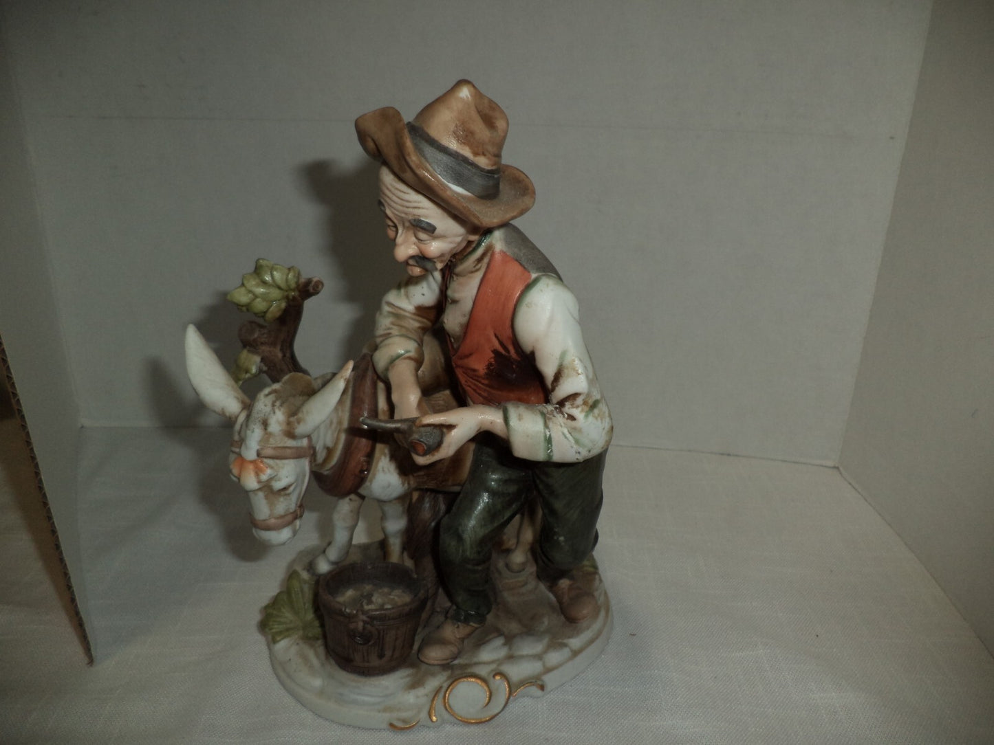 Man With Mule Porcelain Figurine