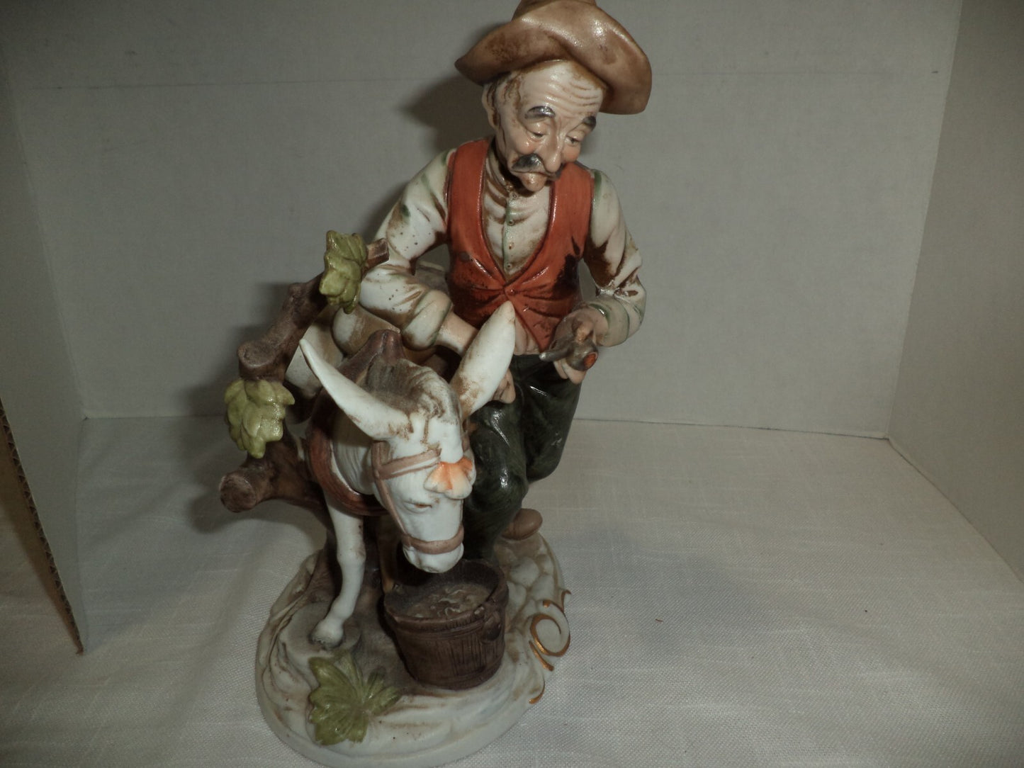 Man With Mule Porcelain Figurine