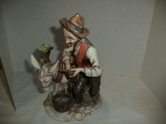 Man With Mule Porcelain Figurine