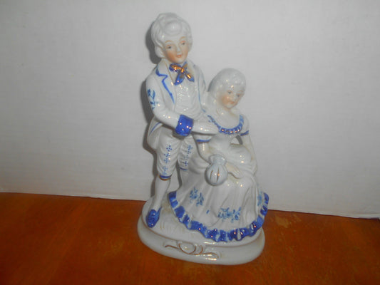 Porcelain Colonial Man & Lady Figurine