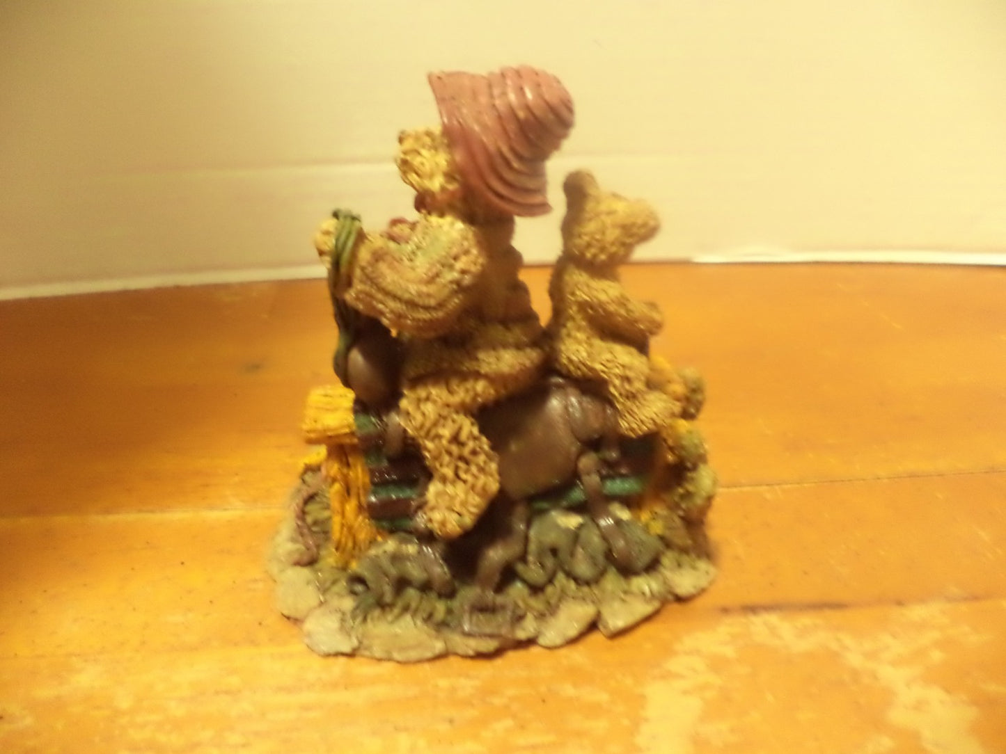 Resin Bear Sitting On Top Of Saddle On Top Of Saw Bench Figurine
