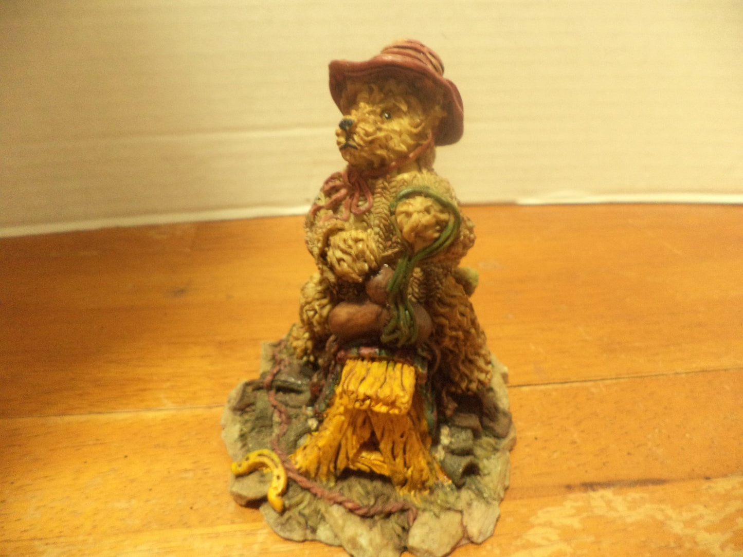 Resin Bear Sitting On Top Of Saddle On Top Of Saw Bench Figurine