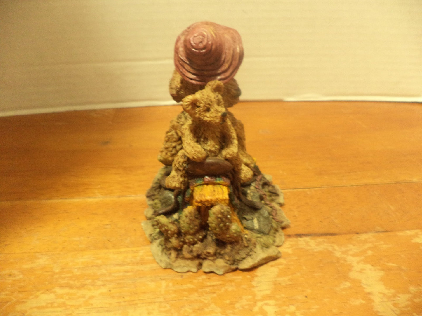 Resin Bear Sitting On Top Of Saddle On Top Of Saw Bench Figurine