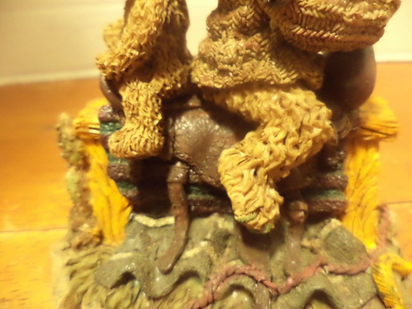 Resin Bear Sitting On Top Of Saddle On Top Of Saw Bench Figurine